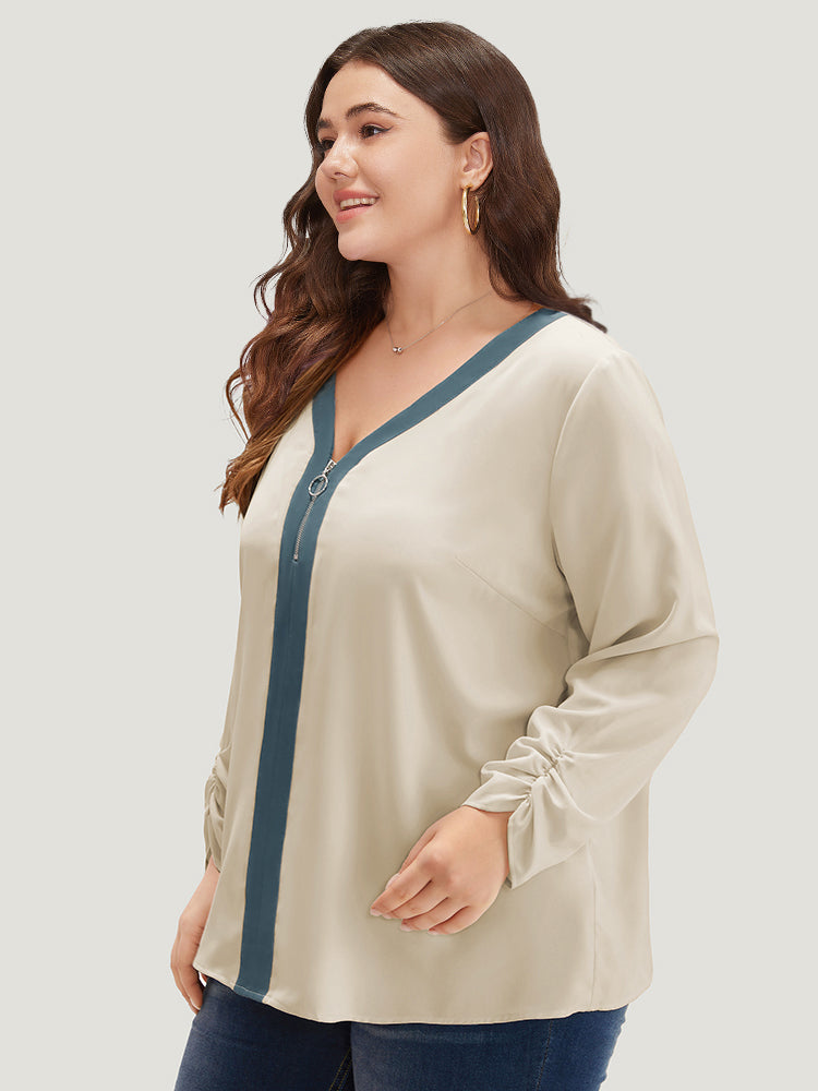 Blusa con cremallera en el escote
