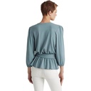 Blusa de punto con sobrefalda