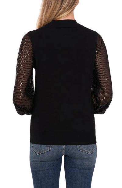Blusa con mangas de lentejuelas