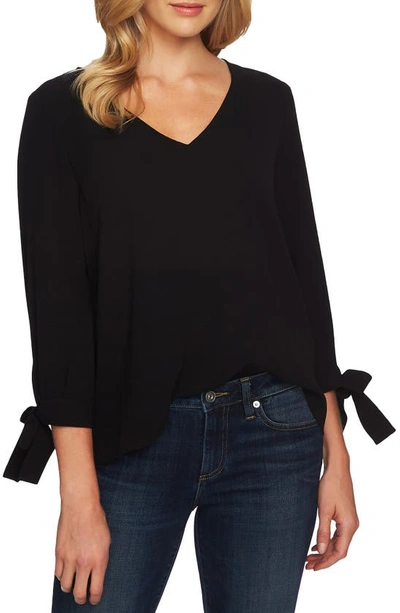 Blusa de crepe con mangas anudadas
