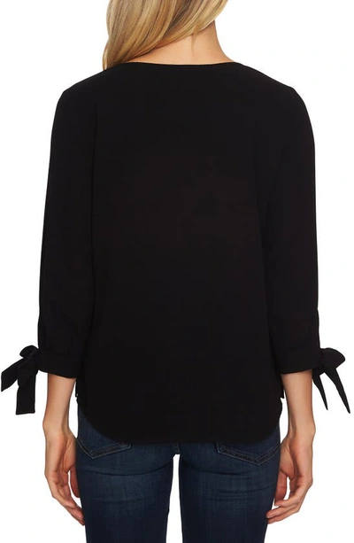 Blusa de crepe con mangas anudadas