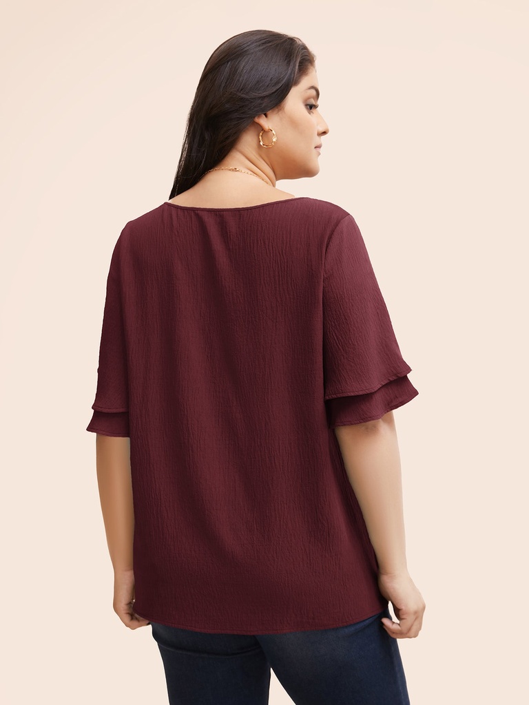 Blusa con volantes escalonados
