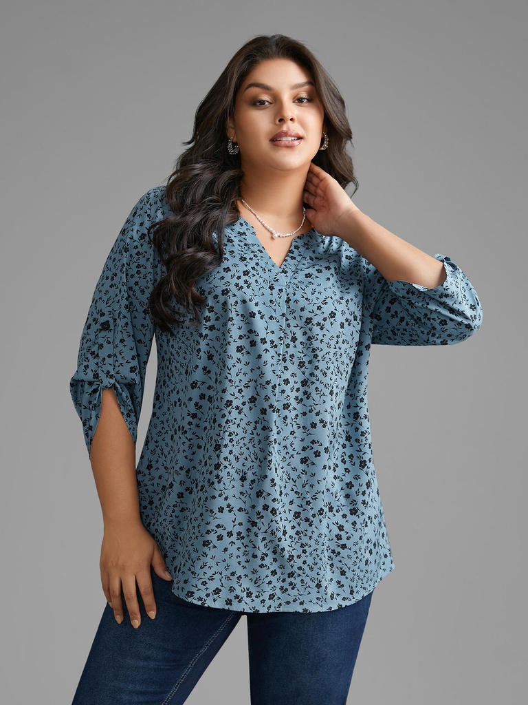 Blusa floral con mangas abotonadas