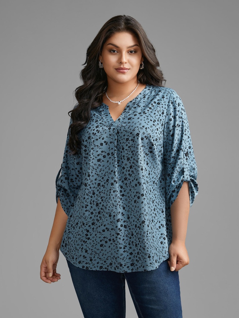 Blusa floral con mangas abotonadas