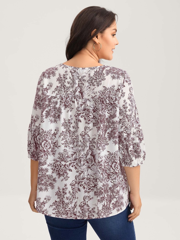 Blusa floral con detalles plisados