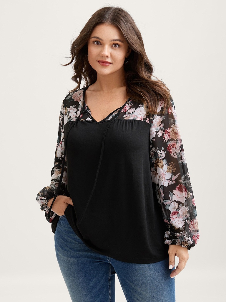 Blusa con mangas de murciélago floral