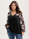 Blusa con mangas de murciélago floral