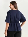 Blusa con adorno en la cintura