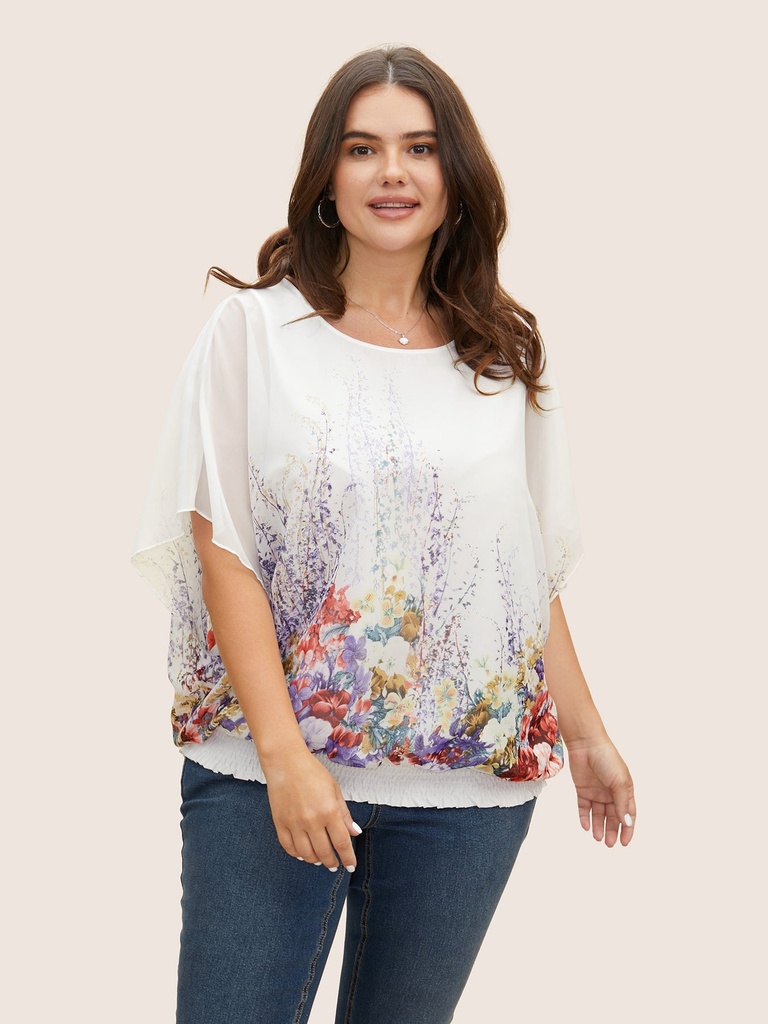 Blusa con mangas de murciélago floral