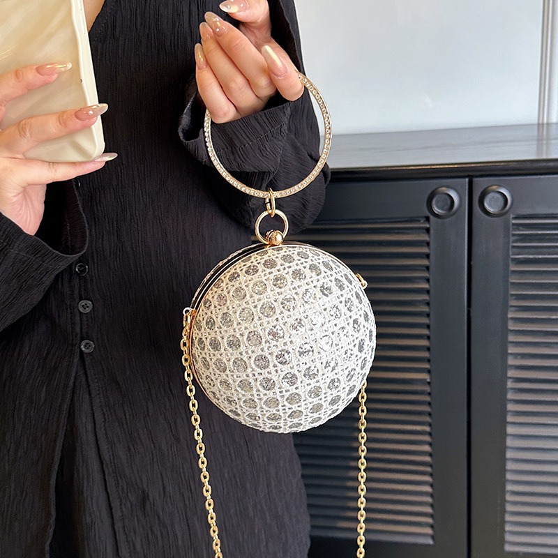 Bolso de mano redondo con diamantes