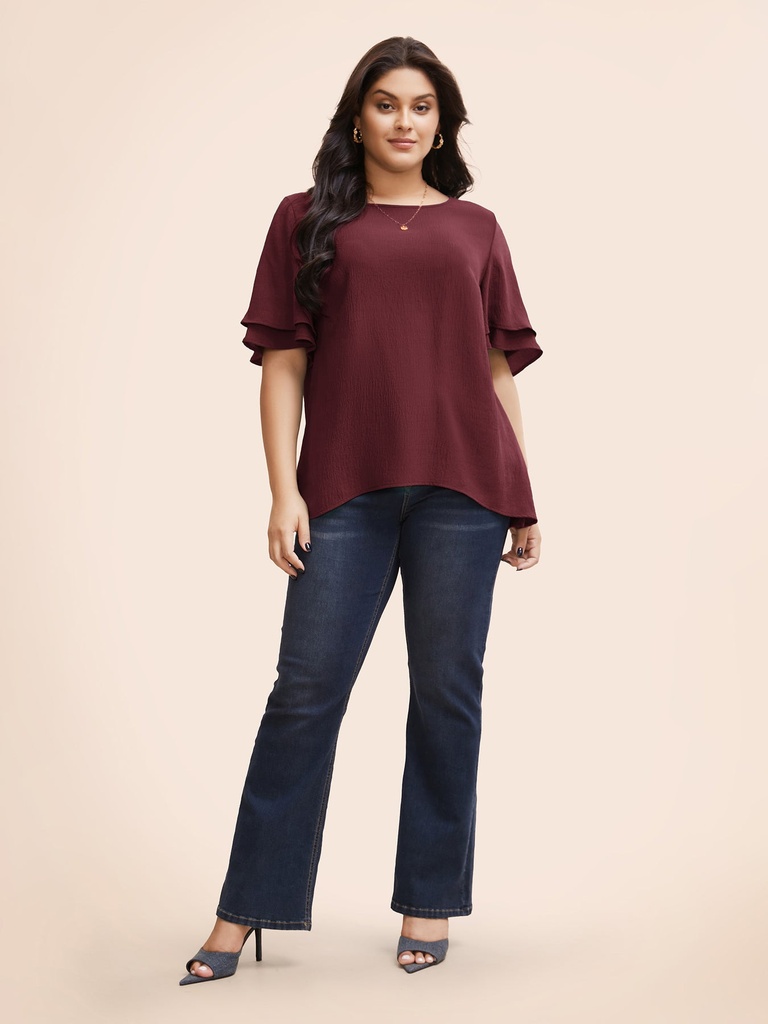 Blusa con volantes escalonados