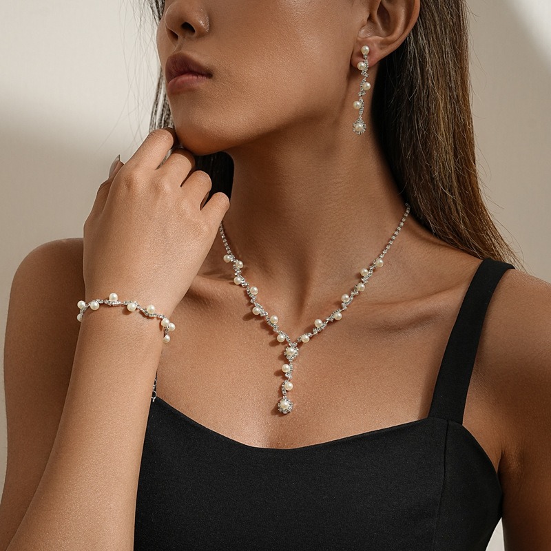 Juego de collar con aretes de perlas