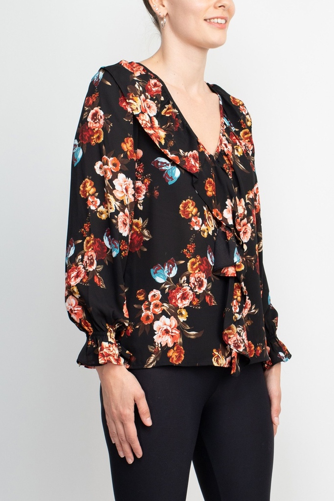 Blusa floral con volantes en el escote 