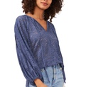 Blusa con ojales y mangas abullonadas