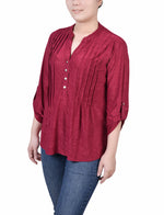 Blusa con mangas enrolladas