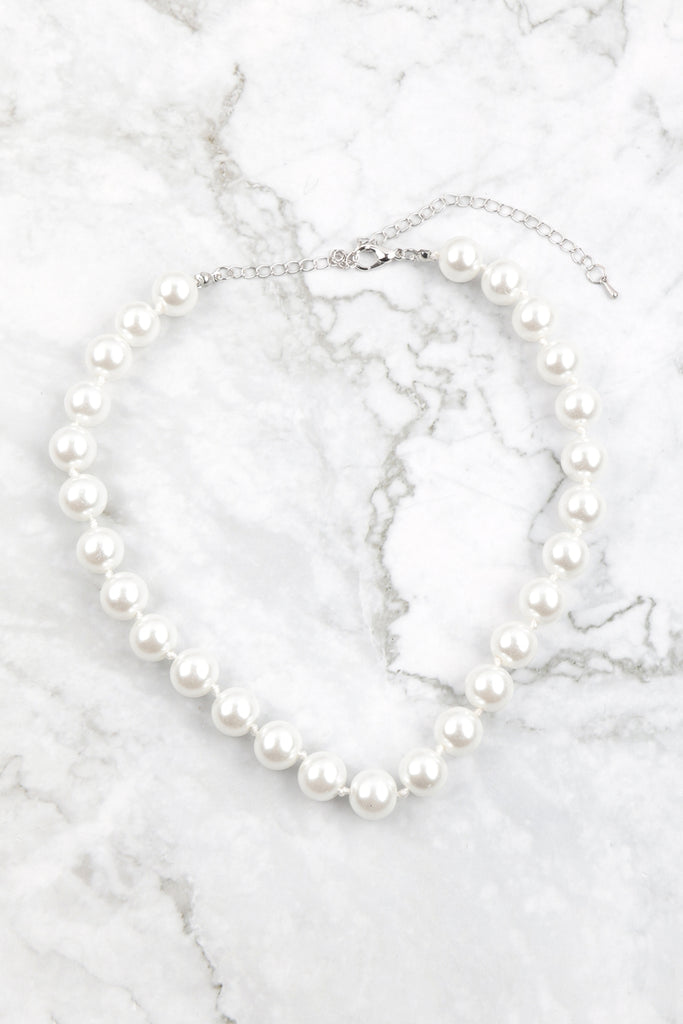 Juego de collar y aretes de perlas