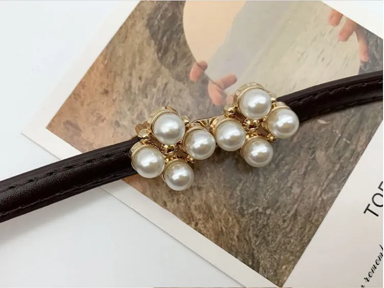 Cinturón con hebilla de perlas
