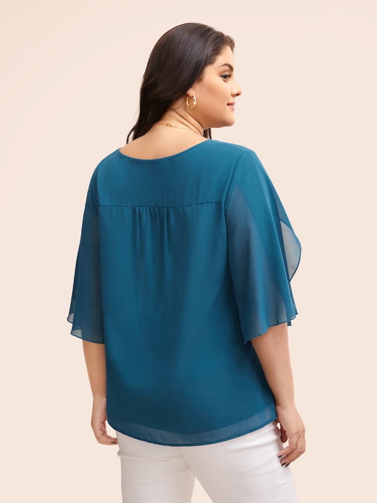 Blusa con mangas de pétalos Egeo