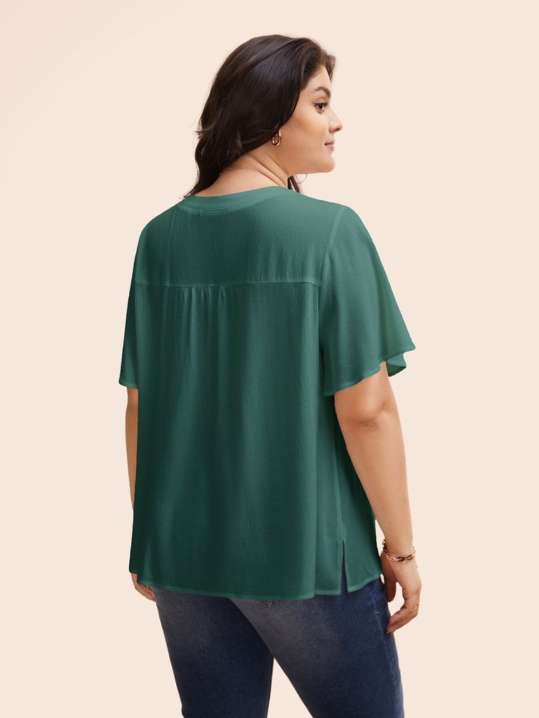 Blusa con cuello de muescas