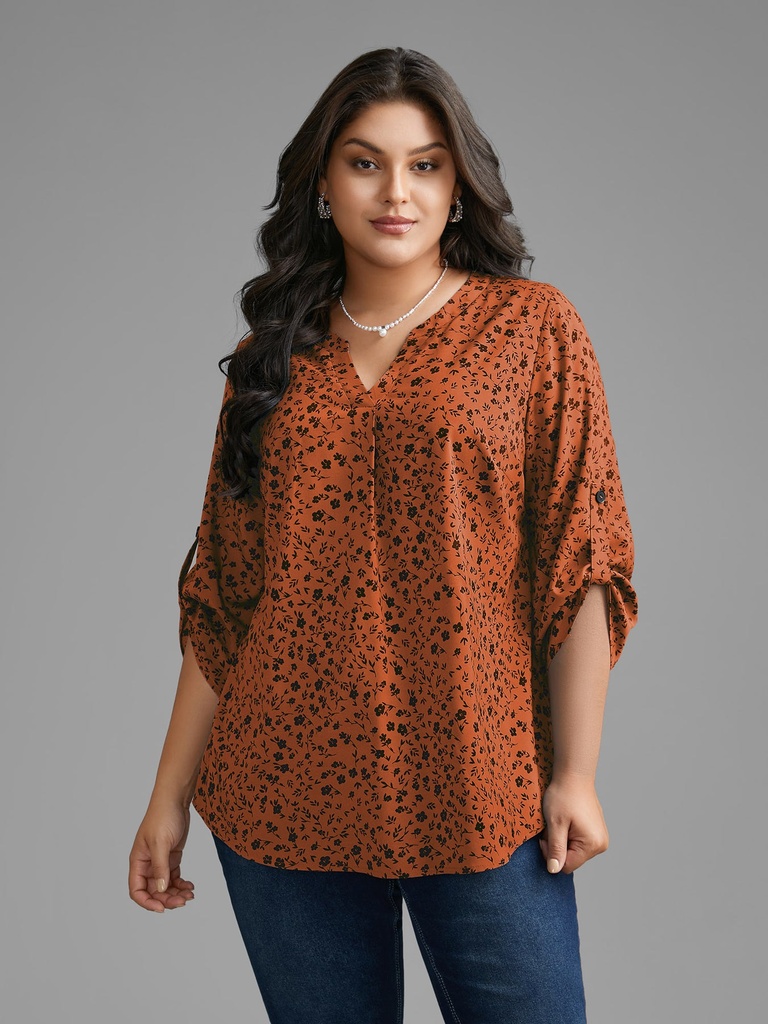 Blusa floral con mangas abotonadas