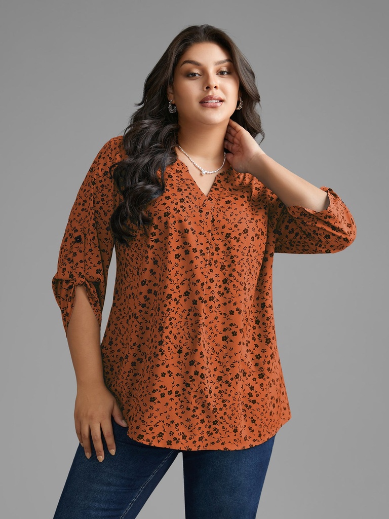 Blusa floral con mangas abotonadas