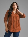 Blusa floral con mangas abotonadas