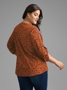 Blusa floral con mangas abotonadas