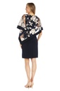 Vestido corto con capa bordada