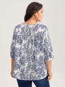 Blusa floral con detalles plisados
