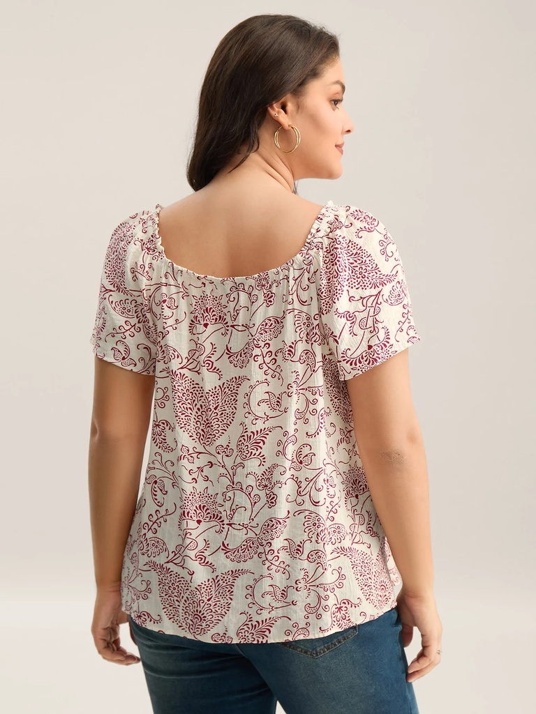 Blusa floral con detalles plisados