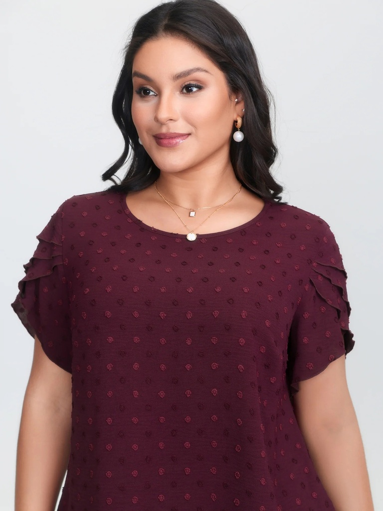 Blusa polka con volantes escalonados