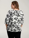 Blusa floral con detalles plisados