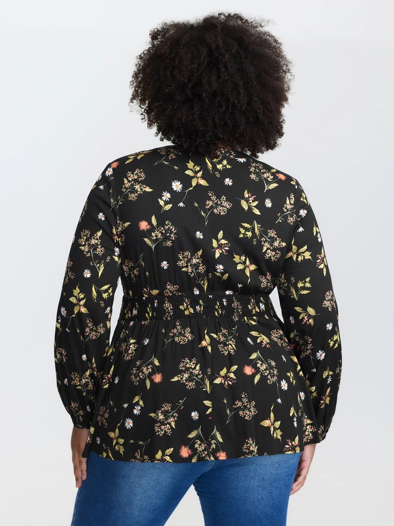 Blusa floral con detalles plisados