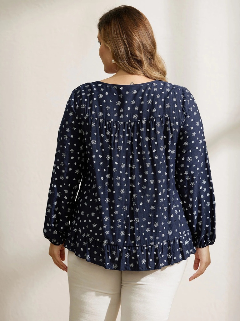 Blusa floral con detalles plisados