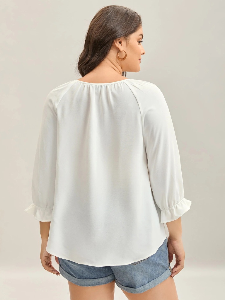 Blusa floral con detalles plisados