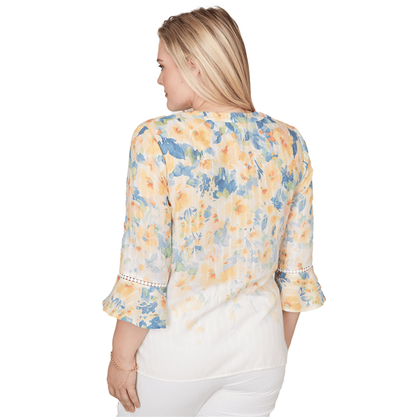 Blusa floral de manga con volantes