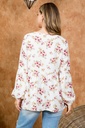 Blusa floral con cordones en escote