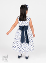 Vestido de lunares con moño