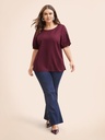 Blusa con mangas abiertas y perlas