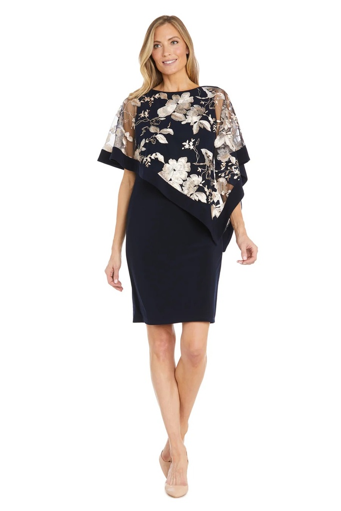 Vestido corto con capa bordada