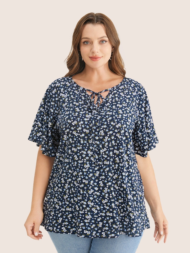 Blusa floral con escote anudado