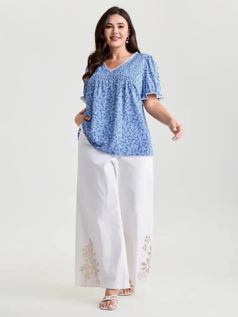 Blusa plisada con ribete de encaje