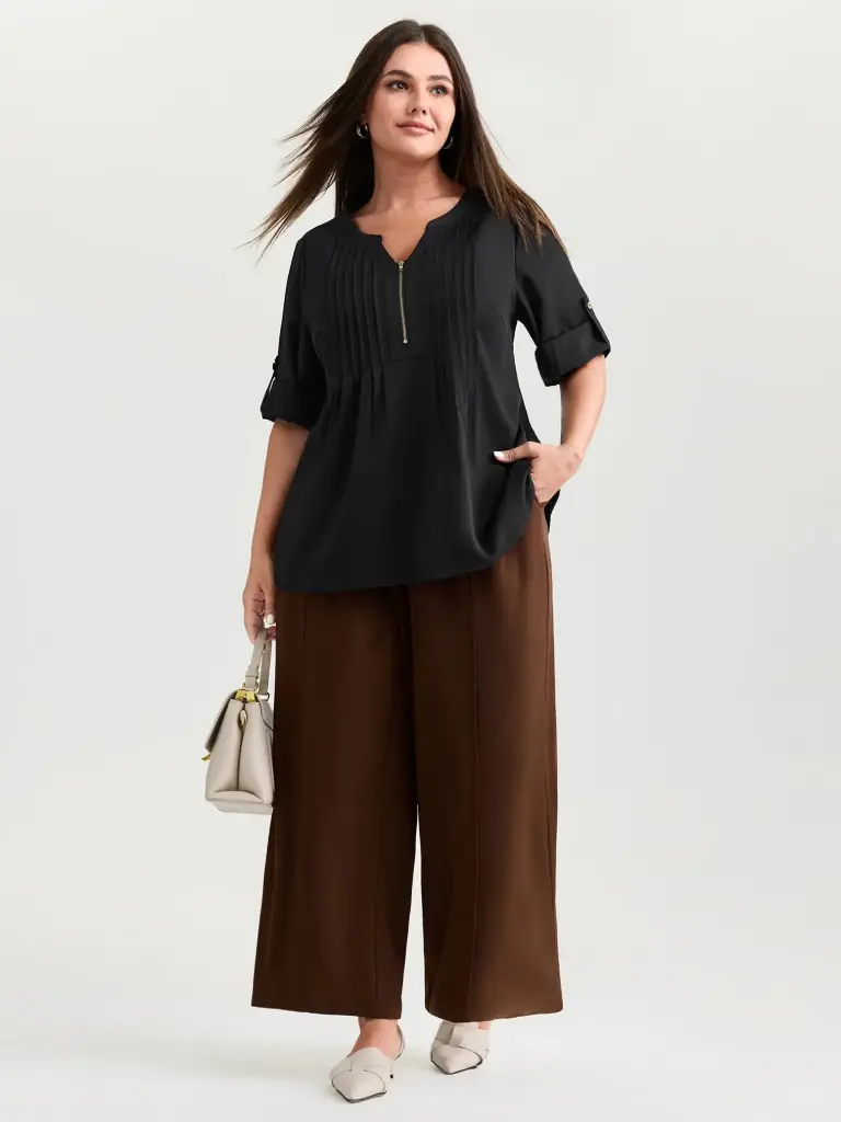 Blusa plisada con cremallera frontal