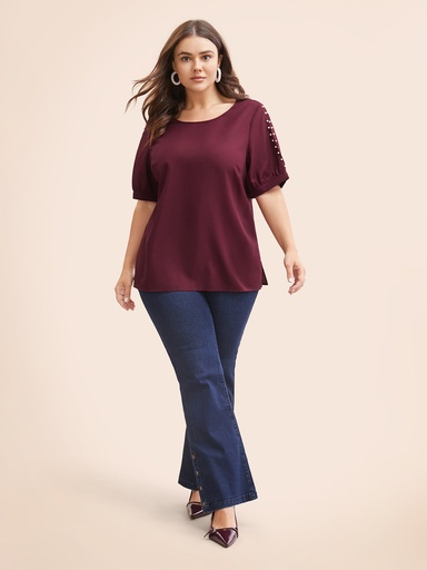 Blusa con mangas abiertas y perlas